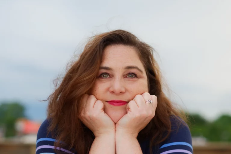 Melanie Sanchez, creative director and multidisciplinary designer, smiling in a natural portrait.